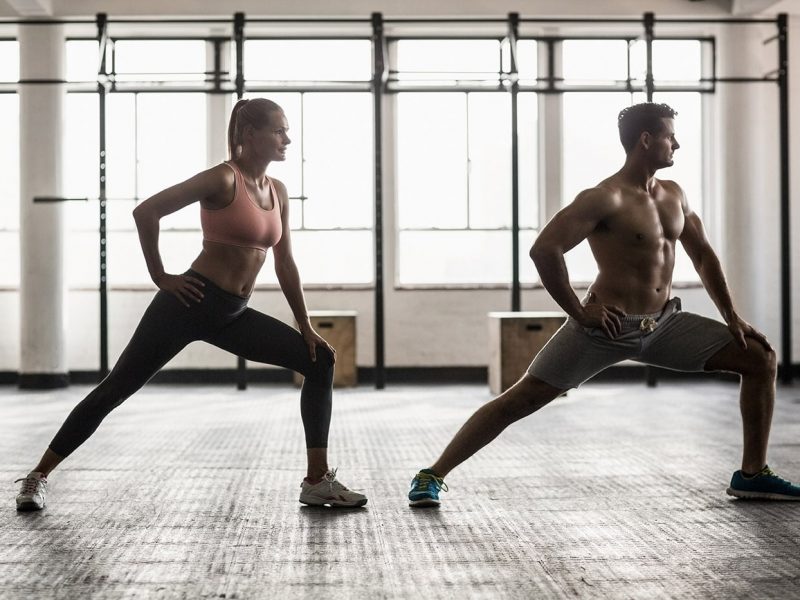 two-fit-people-doing-fitness-in-crossfit-gym-PUD245U-min.jpg